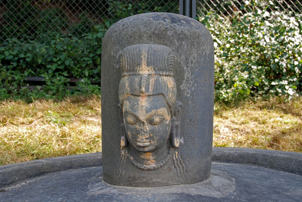 Kathmandu Pashupatinath 17 Lingam On Terrace At the northern end of the Pashupatinath terraces near Kathmandu is a Shiva lingam on a circular pedestal dating from the 6C. A finely featured face of Shiva has been sculpted on one side of the lingam.